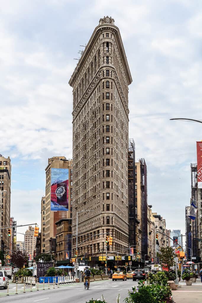 The Flatiron Building, a distinctive triangular skyscraper in New York City.