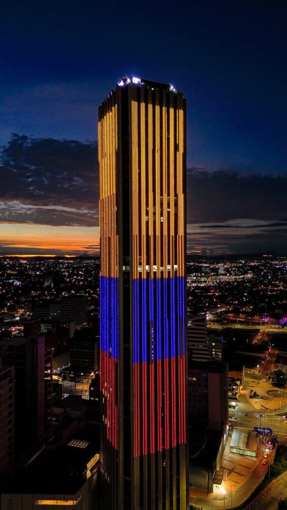 Torre Colpatria glowing at night in Bogotá, Colombia