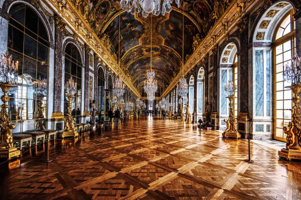 Baroque interior of the Palace of Versailles, showcasing ornate decor.