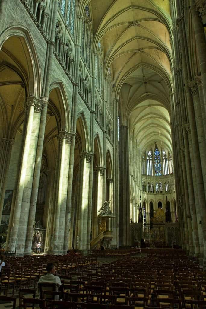 Interior of Amiens Cathedral with soaring Gothic arches.