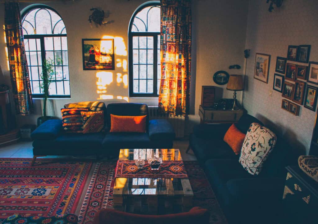 Bohemian living room with colorful patterns.