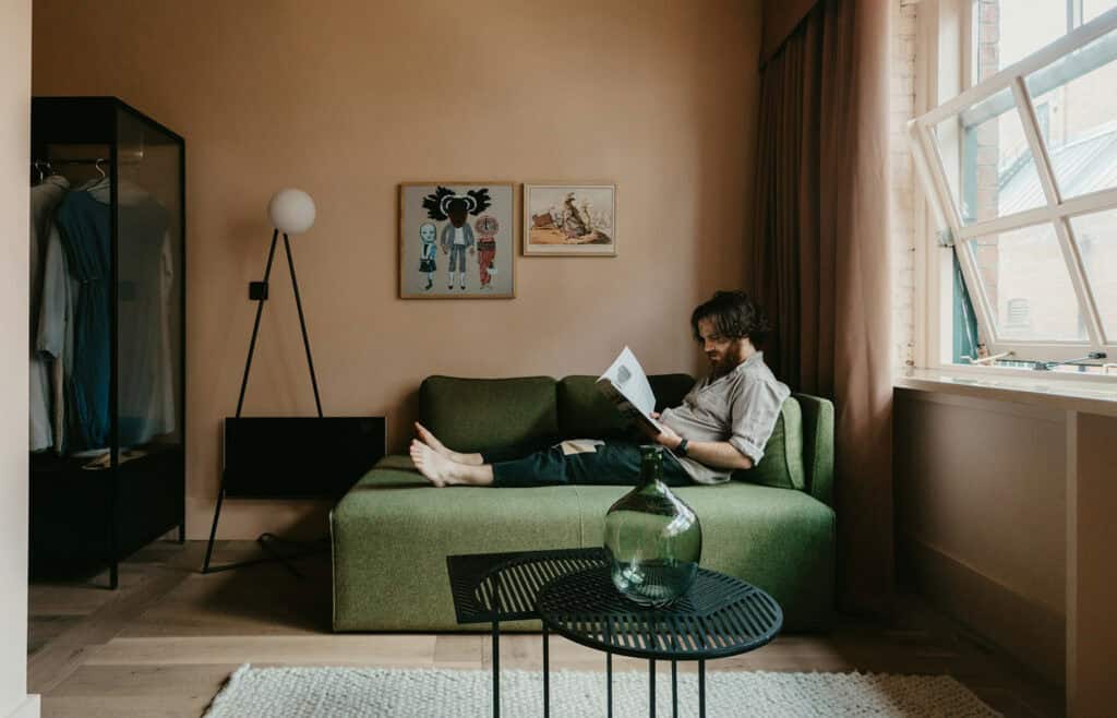 Room with a green sofa as the focal point.