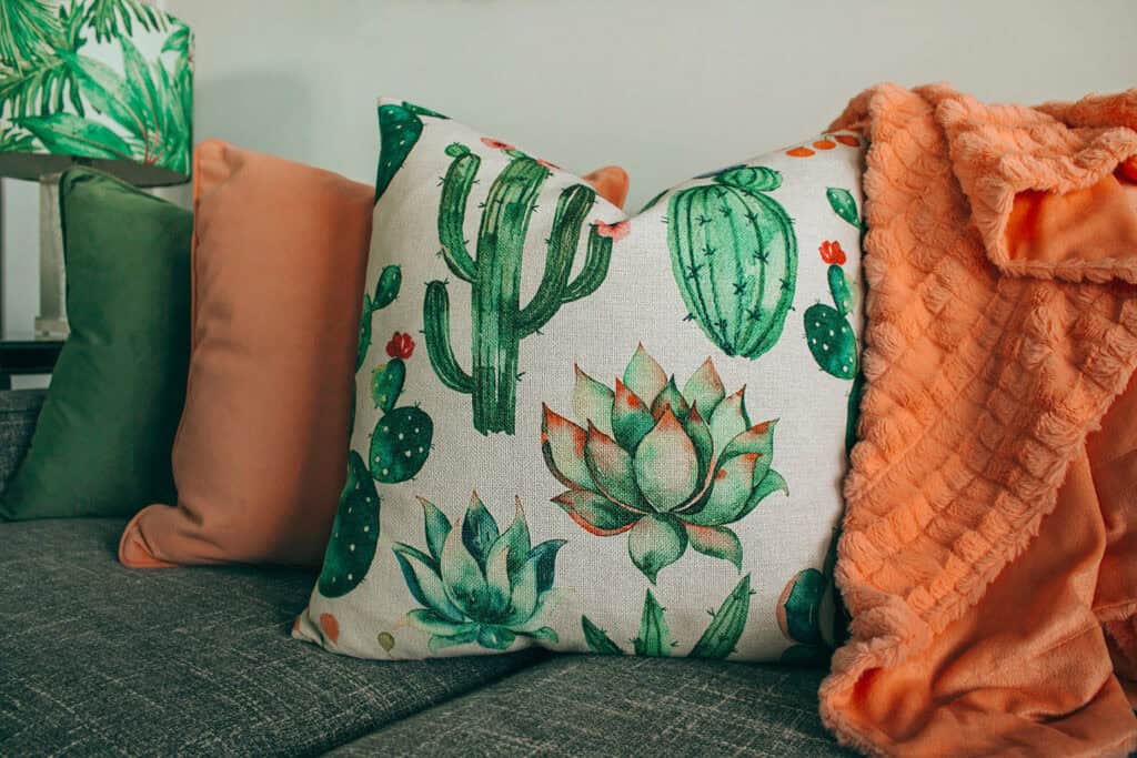 Room with green cactus textures in decor.