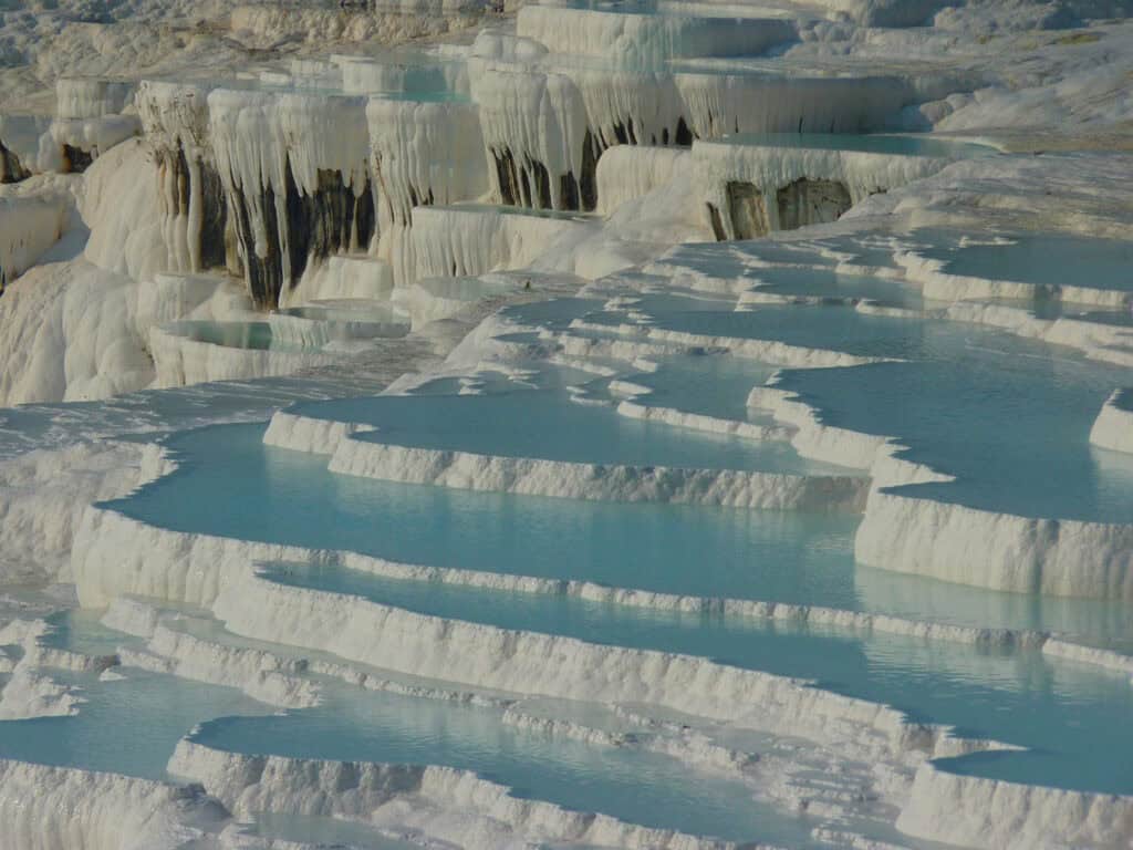 Pamukkale’s white travertine terraces in Turkey.