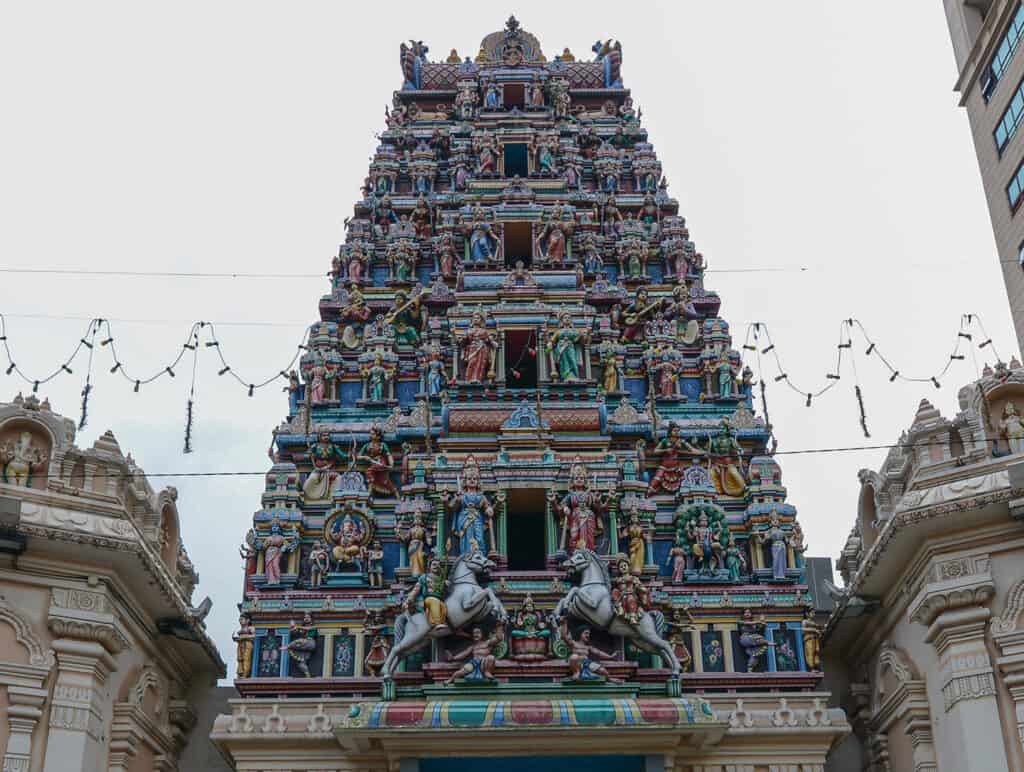 Sri Maha Mariamman Temple with ornate, colorful tower.