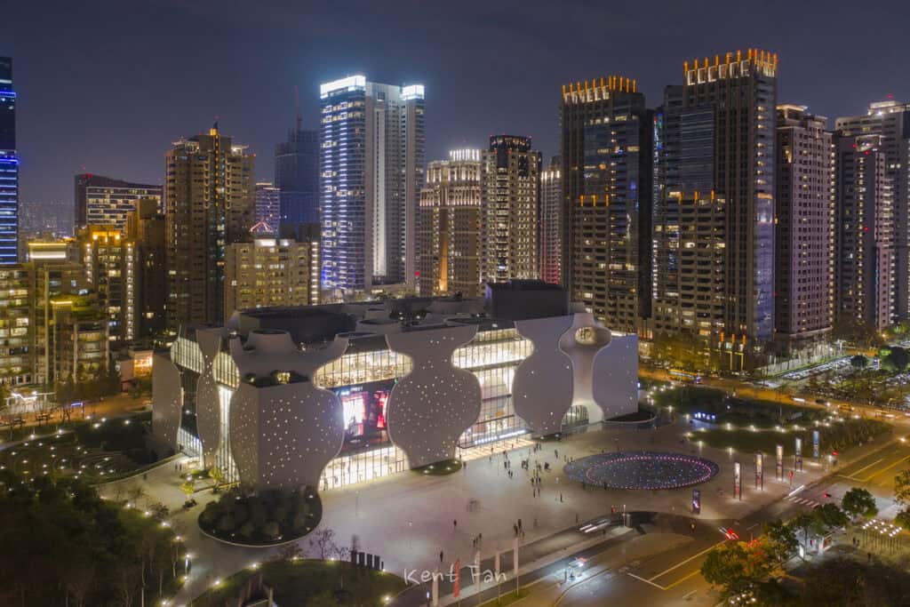 National Taichung Theater illuminated at night.