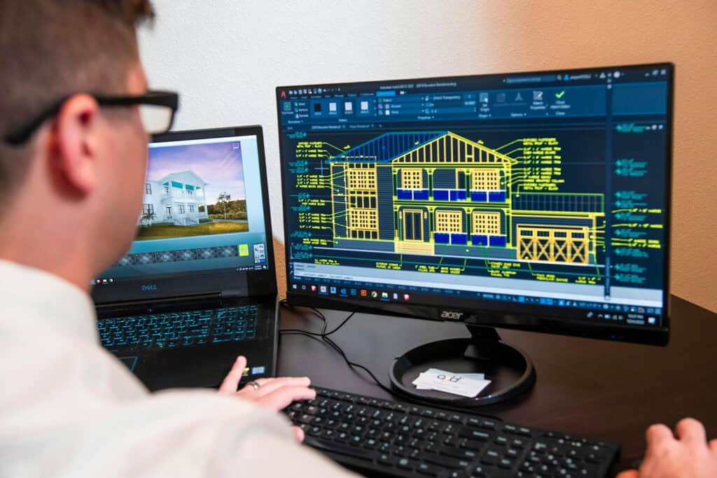 Interior architect designing with CAD software.