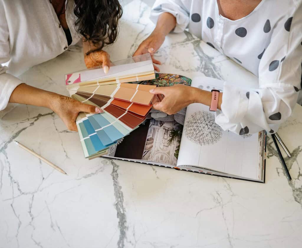 Interior designer holding a color chart.